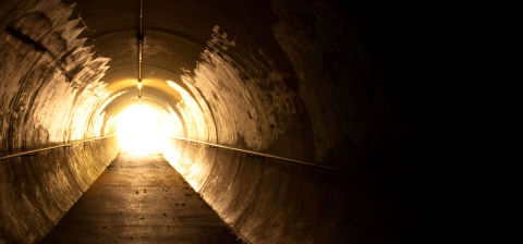 dark tunnel with light at end